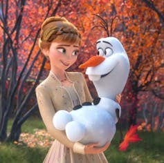 Anna holding Olaf the snowman