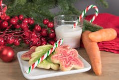 cookies, carrot, candy canes and milk