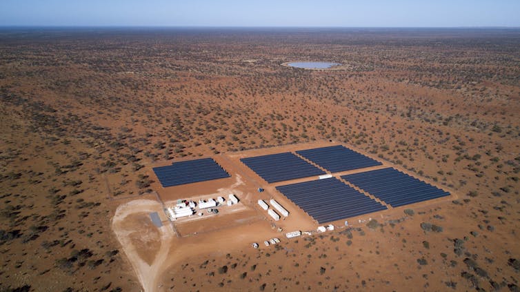 The solar panel array in the middle of the desert.
