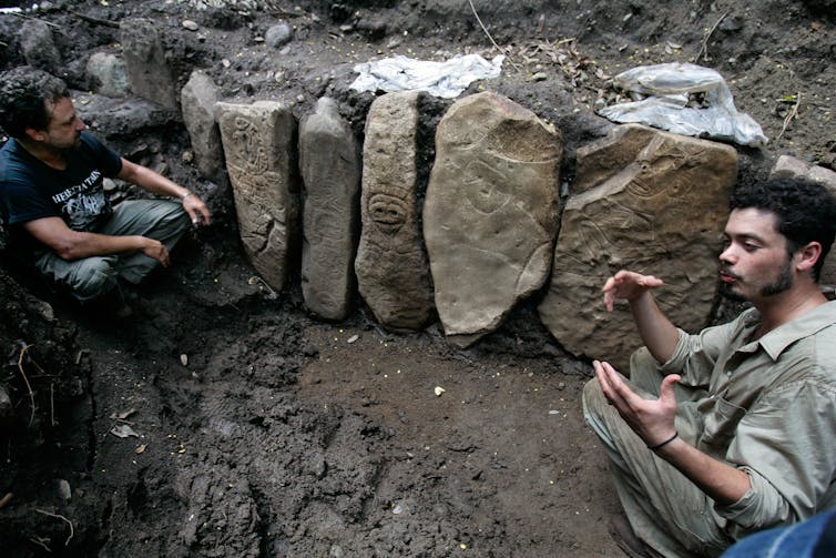 Archaeologists with the Taíno stones and petroglyphs they uncovered near Ponce, Puerto Rico