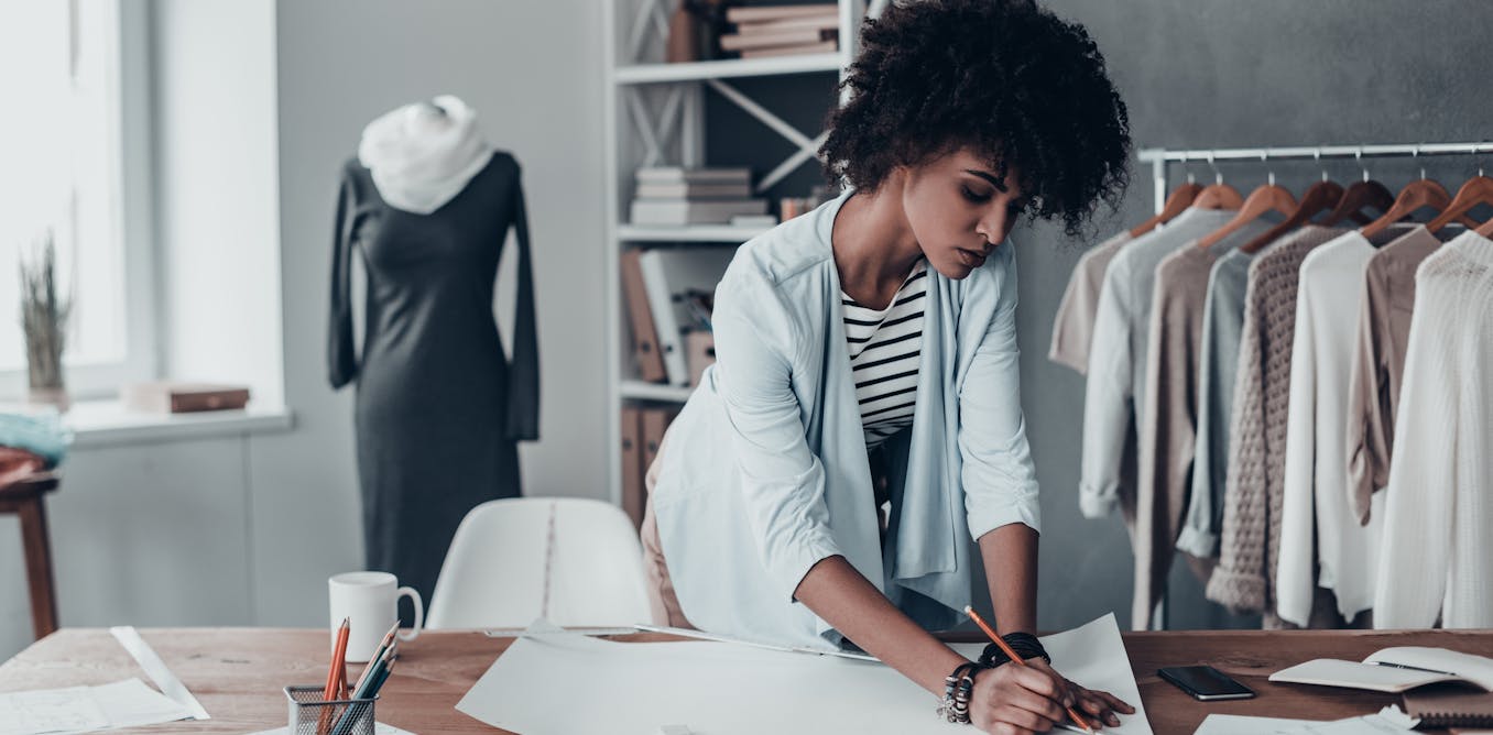 Woman sketching on a piece of paper