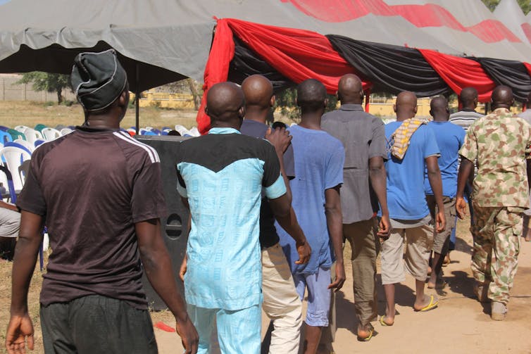 Inmates walk in a line