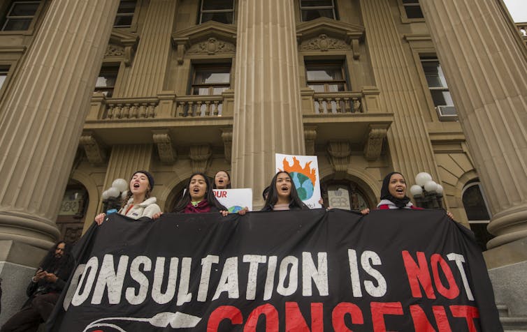 Young people stand on the steps of the Alberta legislature during the climate strike in Edmonton in 2019. Youth are often seen as problems rather than as people who are creating solutions. 