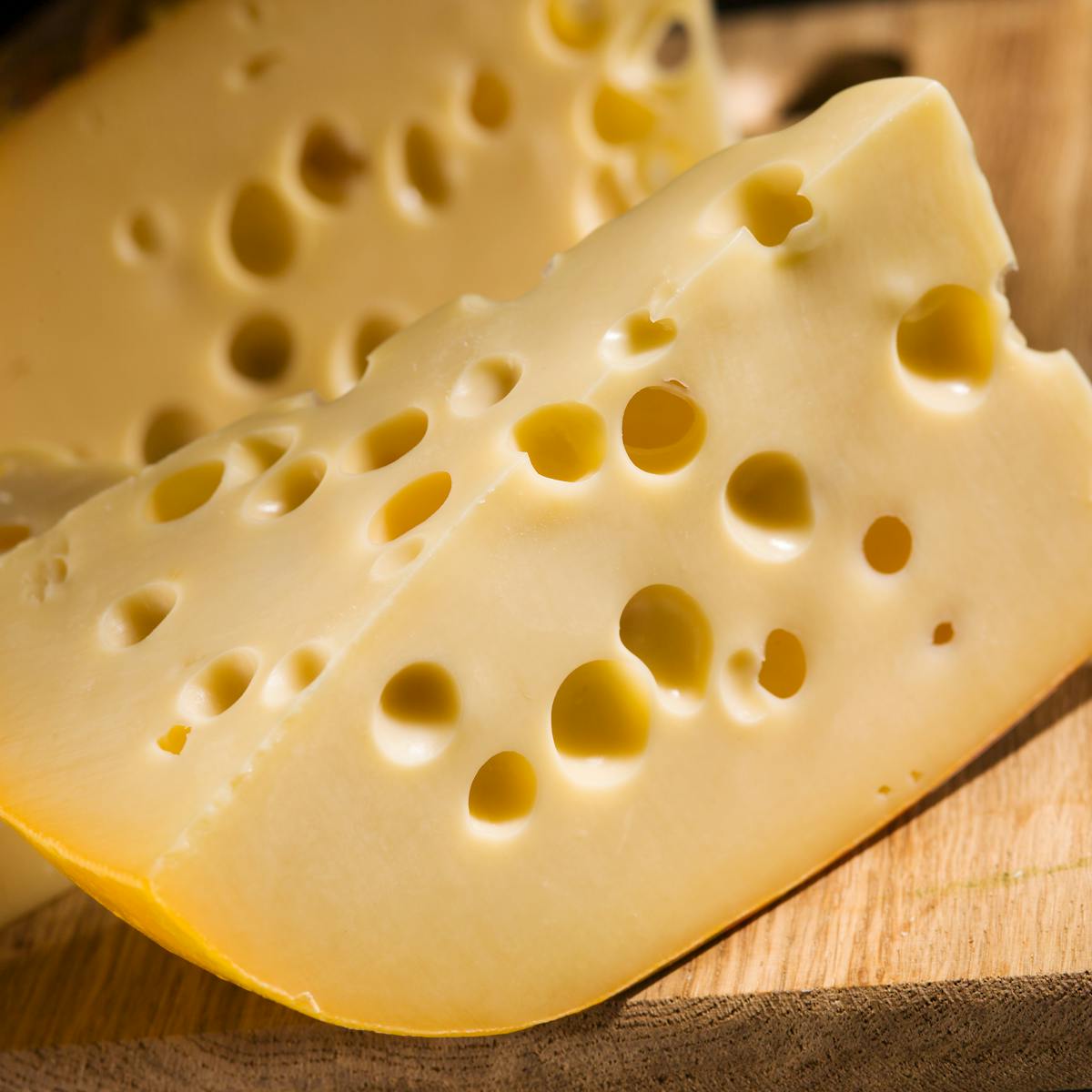 Why does Swiss cheese have holes?
