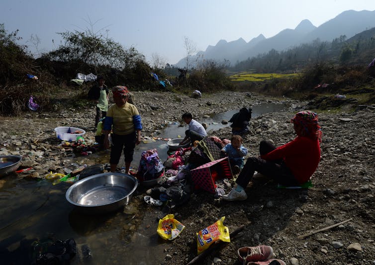 Residents do their washing in Guizhou Province, China, Feb. 20, 2014. While China’s cities explode, rural poverty remains entrenched. MARK RALSTON/AFP via Getty Images