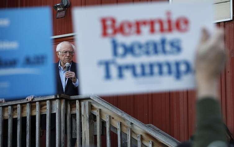 Bernie Sanders is seen speaking to an overflow crowd at a Super Bowl watch party campaign event on Feb. 2, 2020, in Des Moines, Iowa.