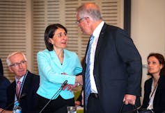 Scott Morrison announces mandatory self-isolation for all overseas arrivals and gives up shaking hands