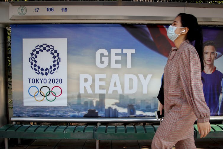 Why haven't the Olympics been cancelled from coronavirus? That's the A$20bn question