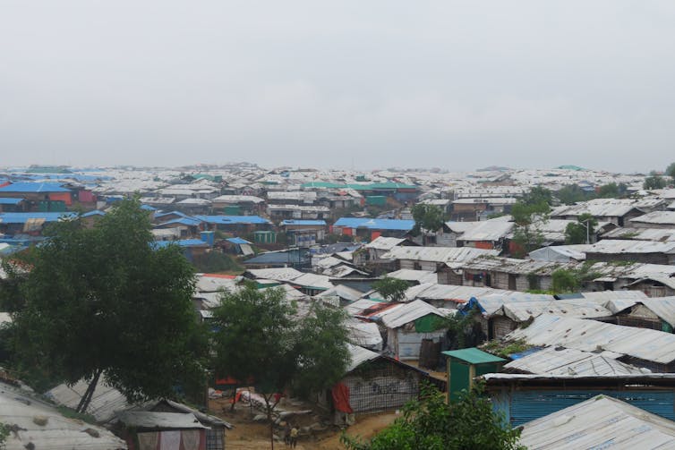 homes in the camp with cloudy gray sky overhead, photo