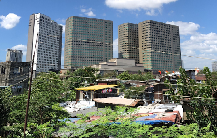 'Forced' evictions eat away at a Manila community as developer spares the golf course next door