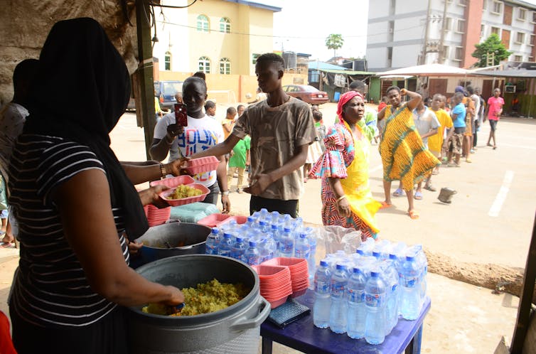 People waiting in food line