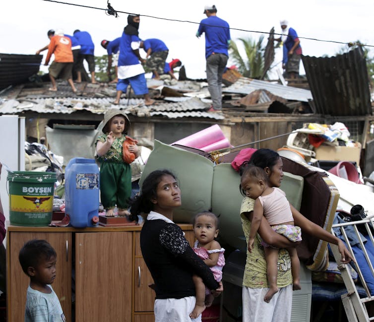 'Forced' evictions eat away at a Manila community as developer spares the golf course next door