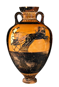 An ancient Greek vase with an image of a four horse chariot.