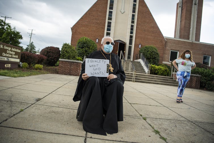 No justice, no peace: Why Catholic priests are kneeling with George Floyd protesters