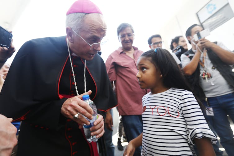 No justice, no peace: Why Catholic priests are kneeling with George Floyd protesters