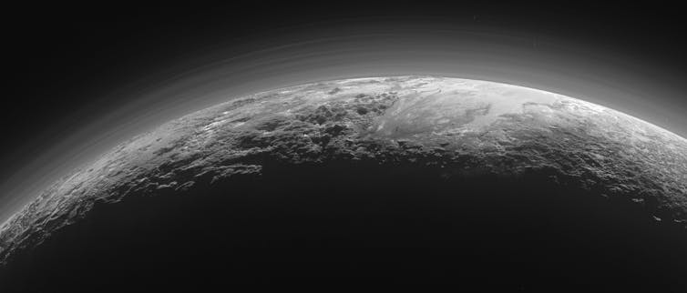 Near-sunset view of Pluto’s rugged, icy mountains and flat plains. NASA/Johns Hopkins University Applied Physics Laboratory/Southwest Research Institute