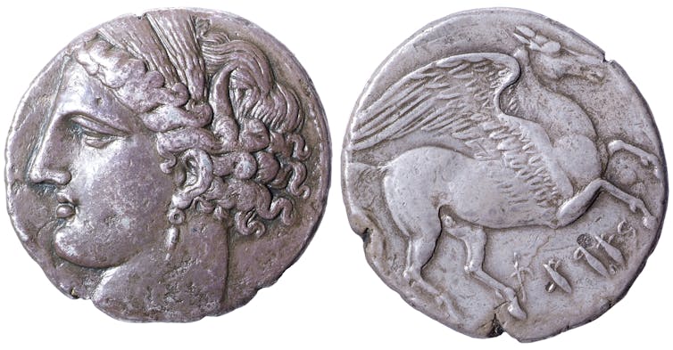 A silver coin minted in Carthage, featuring the Head of Tanit and Pegasus.
