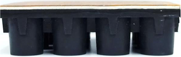 Cross-section of flooring showing rubber cylinders on the underside.