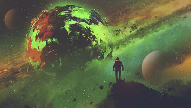 A man gazes at a distant fictional green planet.