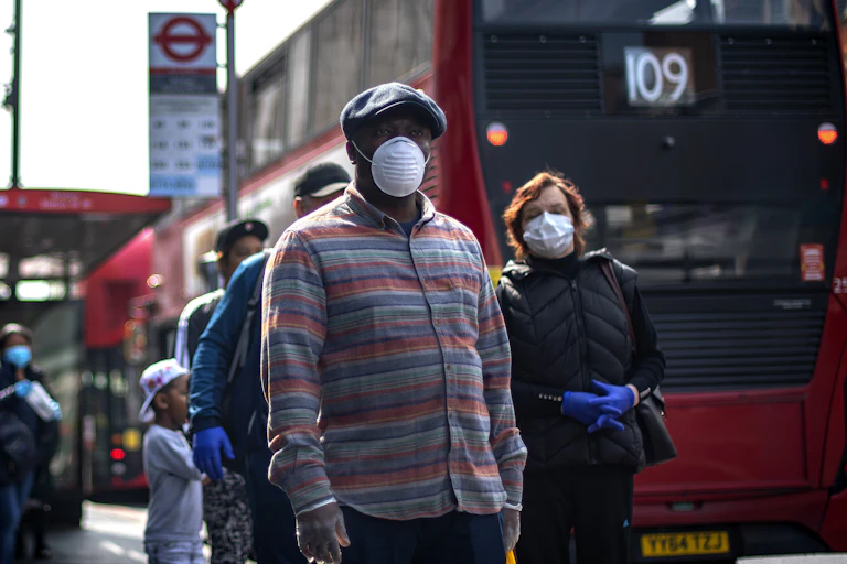 Londoners wait for the bus during lockdown.