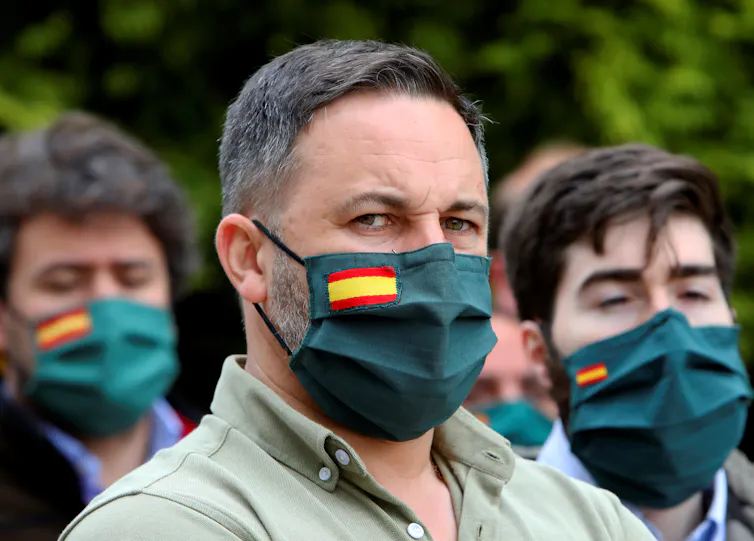 Vox party supporters wearing masks.