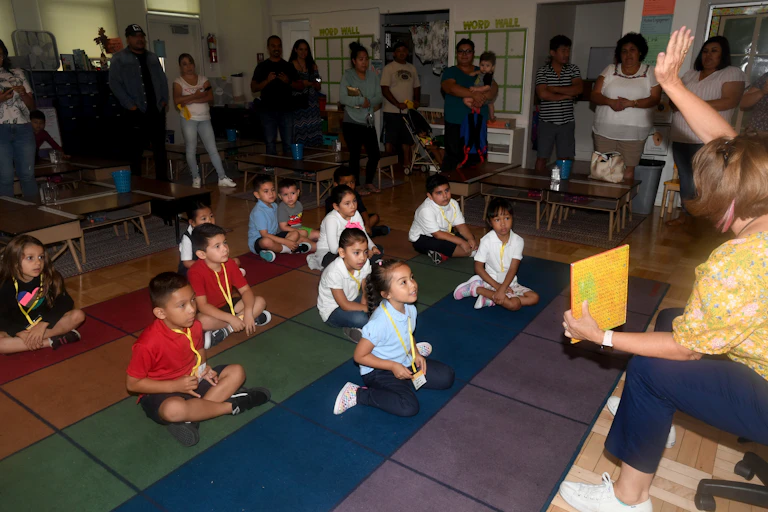 Mrs. Davis reads No David! by David Shannon to her students on the first day of kindergarten at McKinley Elementary School in Long Beach on Wednesday, August 28, 2019.