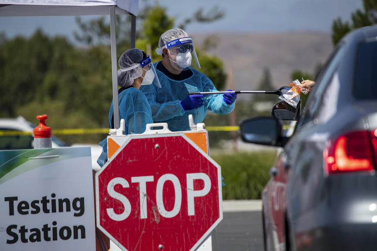 Healthcare workers at a testing station in Irvine, California.