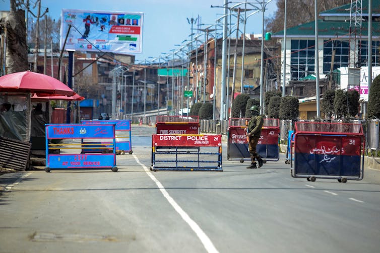 Barricades and a soldier on a Kashmir street