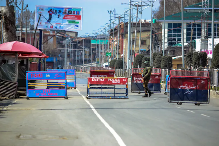 Barricades and a soldier on a Kashmir street