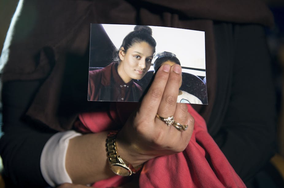 Person holding photo of girl
