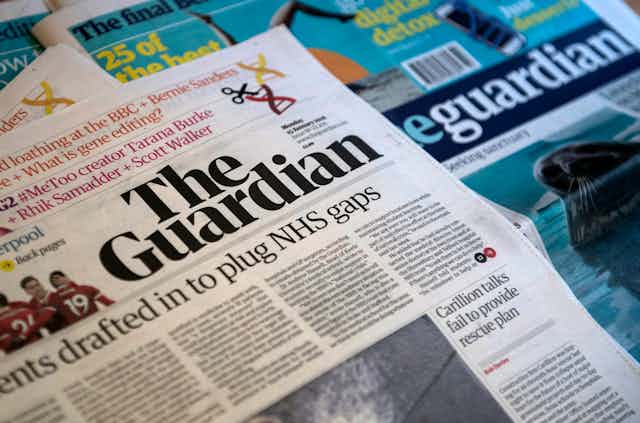 A pile of Guardian newspapers