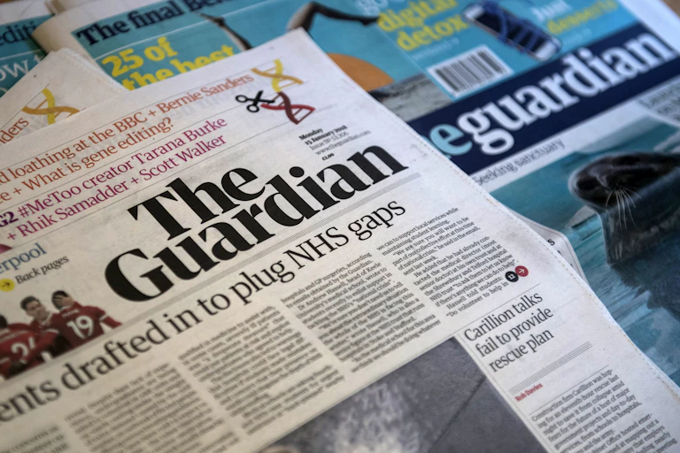 A pile of Guardian newspapers