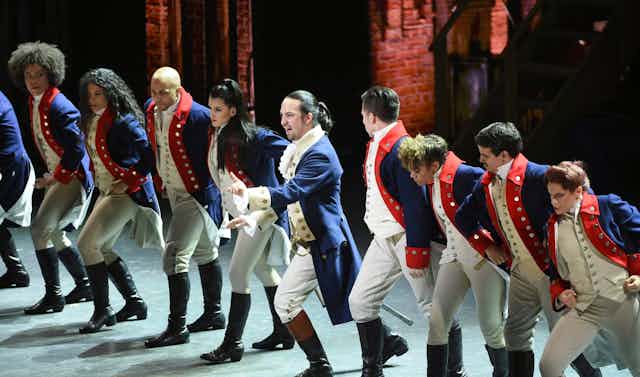 Lin-Manuel Miranda, center, and the cast of "Hamilton" perform at the Tony Awards in New York on June 12, 2016, dressed in their period costumes as revolutionary-era American men. 