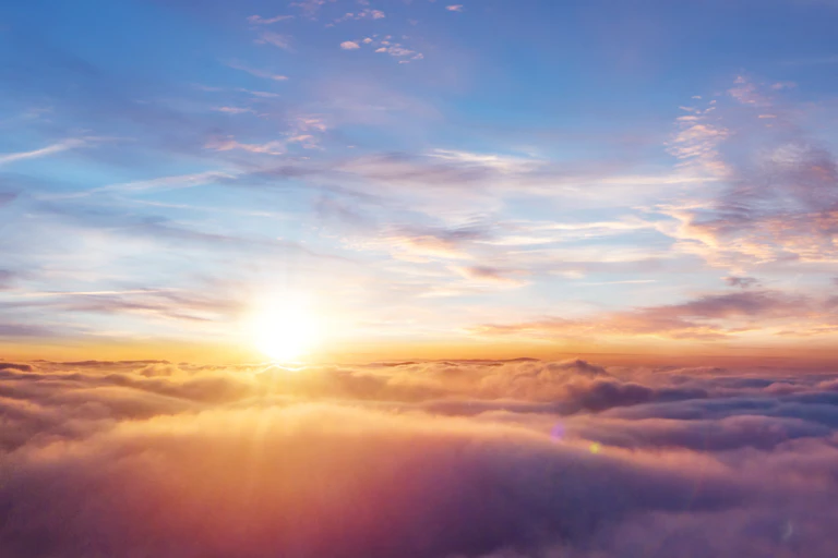 Sunset above the clouds.