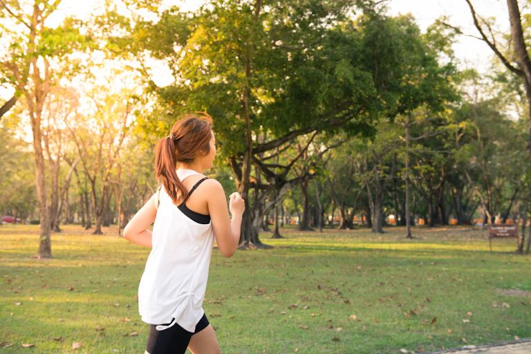 Woman running in park.