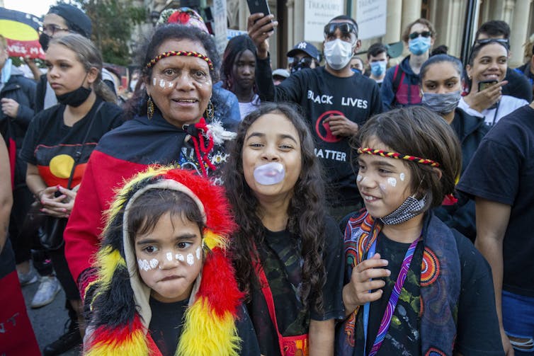 Mother and young children at Australian Black Lives Matter protest.