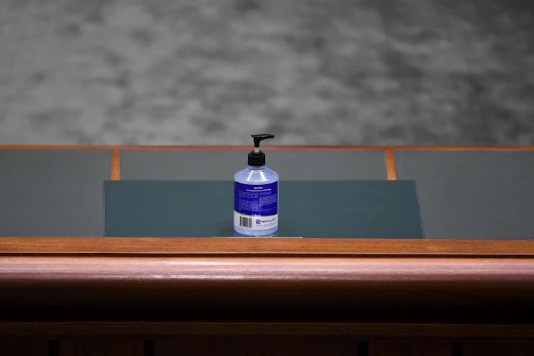 A bottle of hand sanitiser on a House of Representatives table