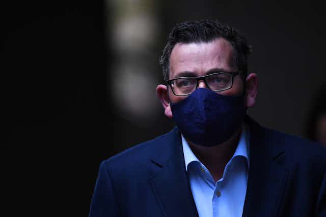 Daniel Andrews wearing a face mask