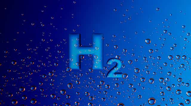 The chemical element 'H2' on a blue background with bubbles.