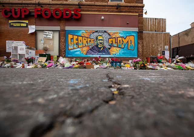 Flowers left at makeshift memorial for George Floyd in Minneapolis