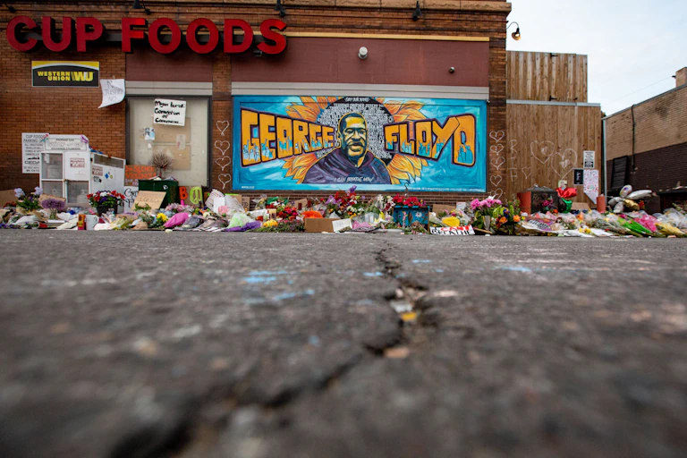 Flowers left at makeshift memorial for George Floyd in Minneapolis
