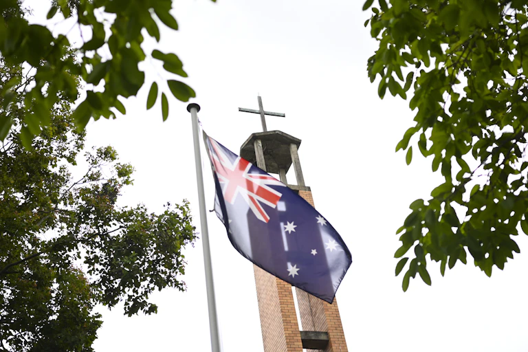 Australian flag flying in front of church