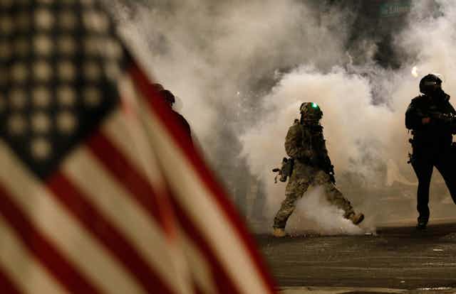 Federal officers using tear gas at an anti-racism protest in Portland, Oregon on July 21.