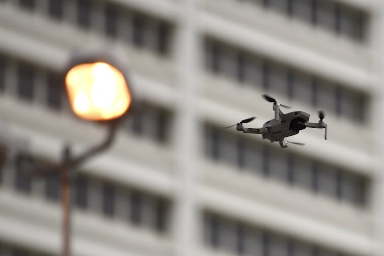 small drone over a city street