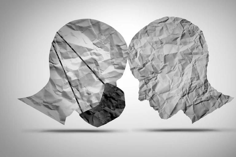 One face wearing a mask, one not, head to head