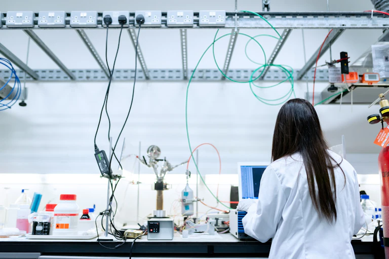 Female scientist working in an electronics lab