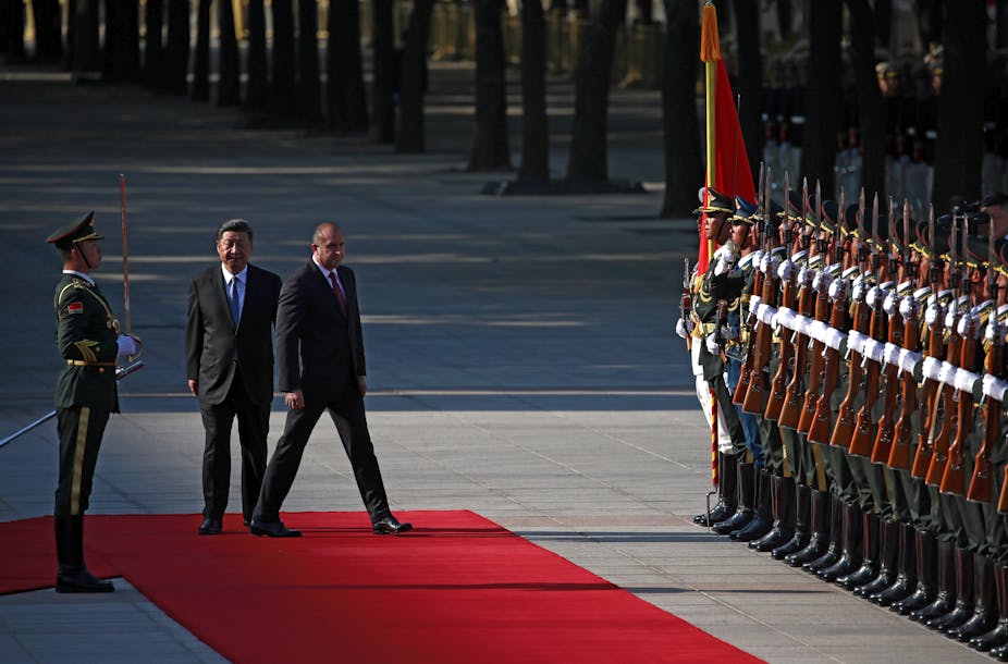 Xi Jinping and Rumen Radev next to row of Chinese soldiers