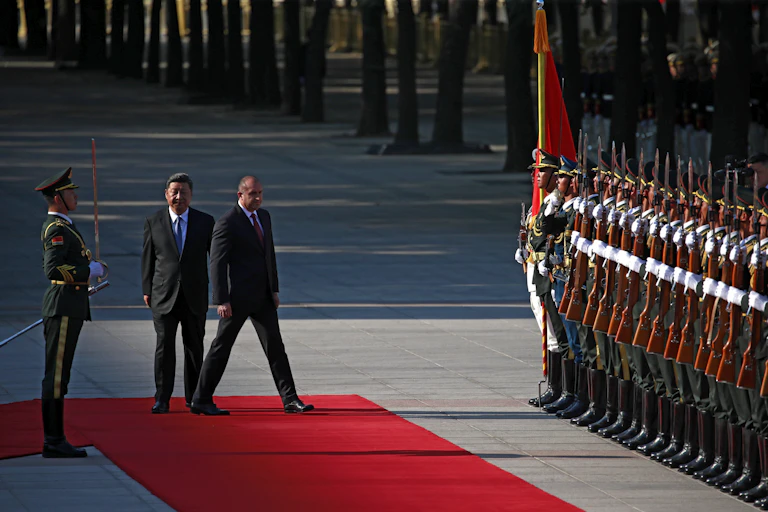 Xi Jinping and Rumen Radev next to row of Chinese soldiers