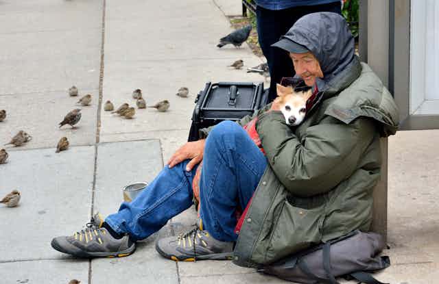 Homeless person with a dog