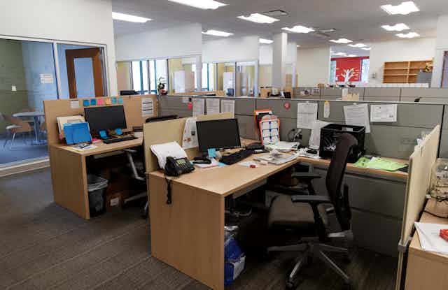 Cubicles and desks in an office building.
